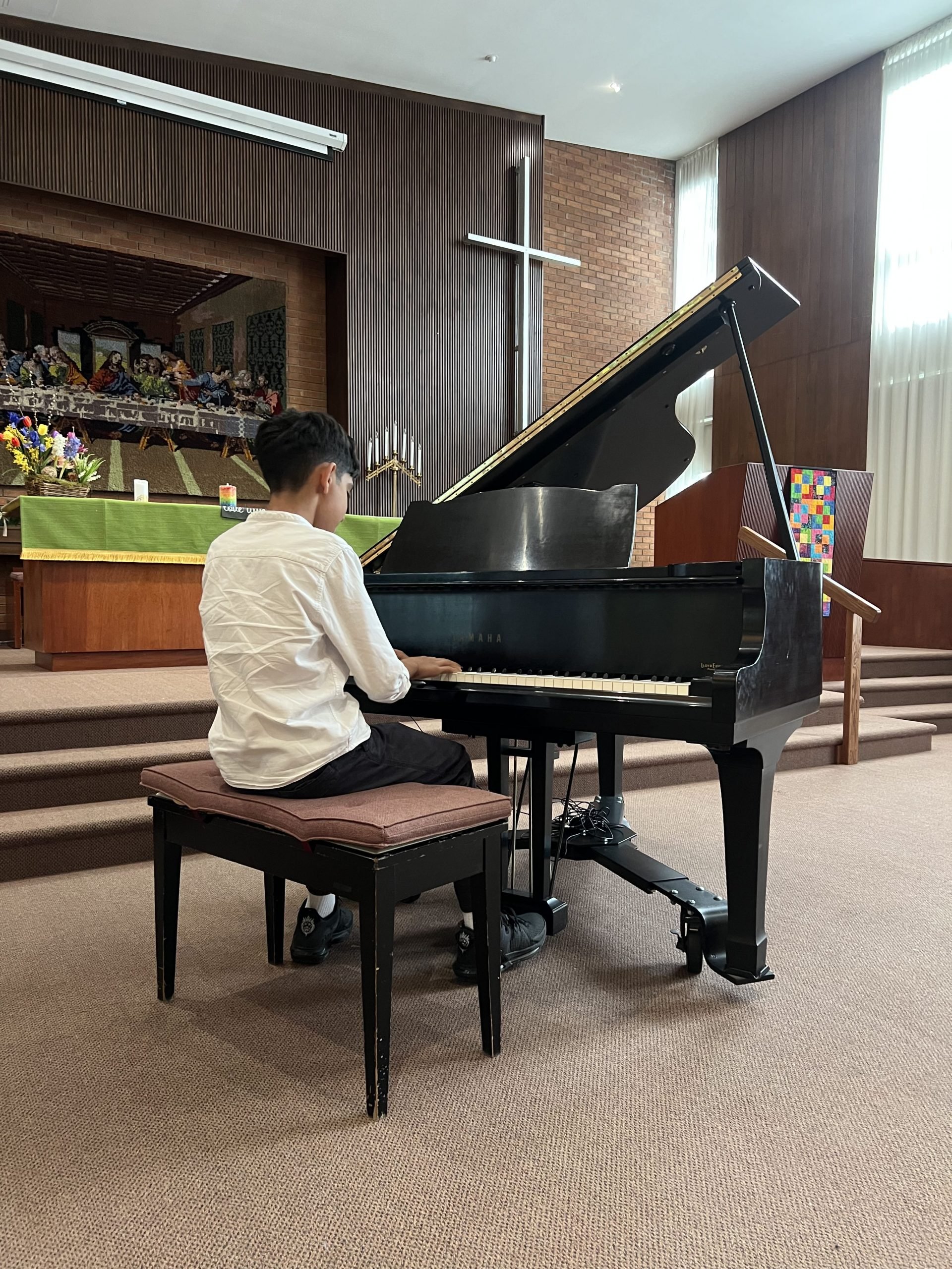 Student playing piano